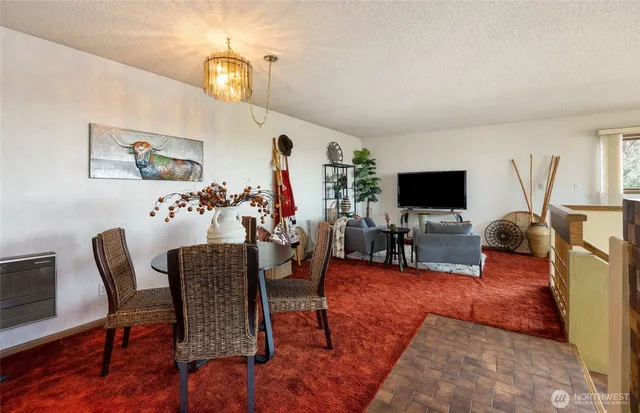 a view of a livingroom with workspace and a couch