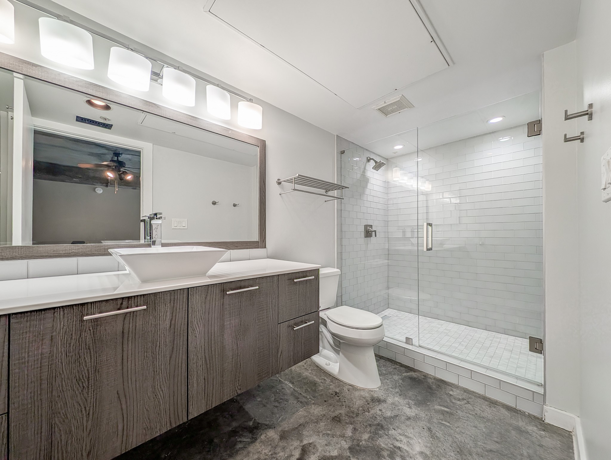 2000 Bagby Street, Unit 7417 Houston, TX 77002 - Photo 8 of 11 a bathroom with a double vanity sink toilet and shower