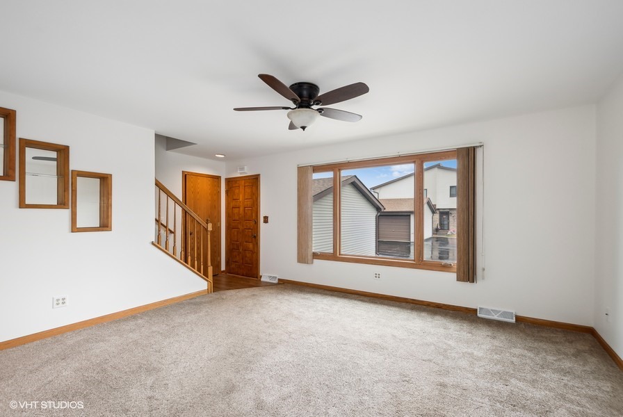 1073 Southgate Road New Lenox, IL 60451 - Photo 3 of 18 a view of an empty room with ceiling fan
