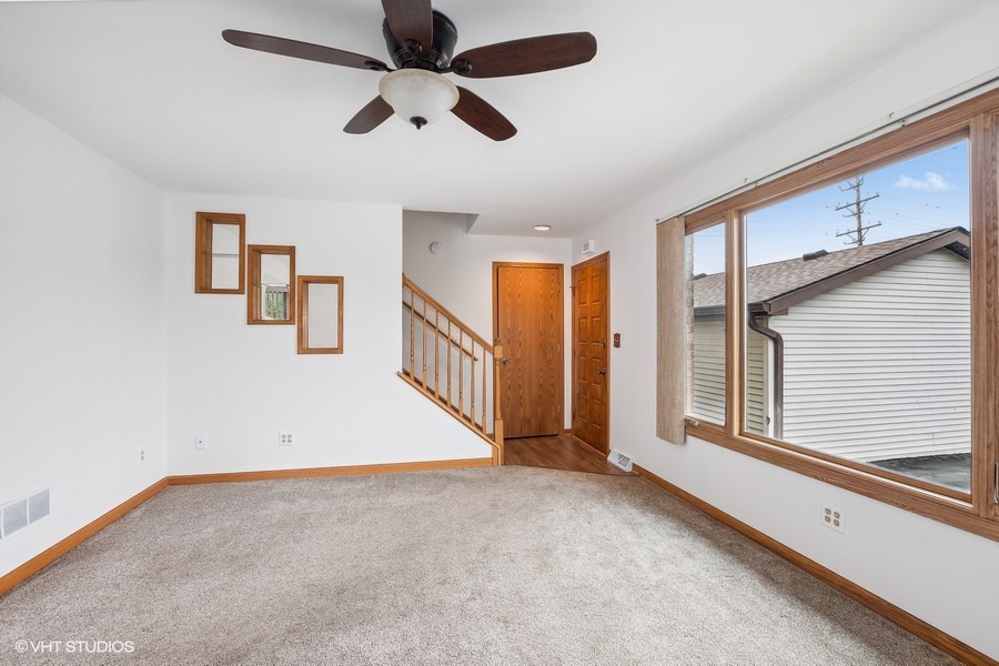 1073 Southgate Road New Lenox, IL 60451 - Photo 4 of 18 wooden floor in an empty room with a window
