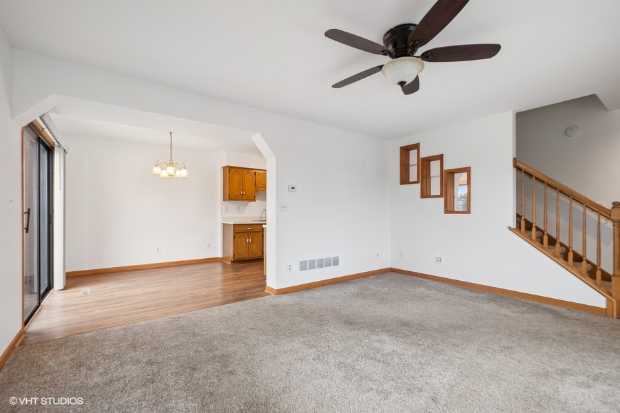 1073 Southgate Road New Lenox, IL 60451 - Photo 5 of 18 a view of an empty room with a ceiling fan