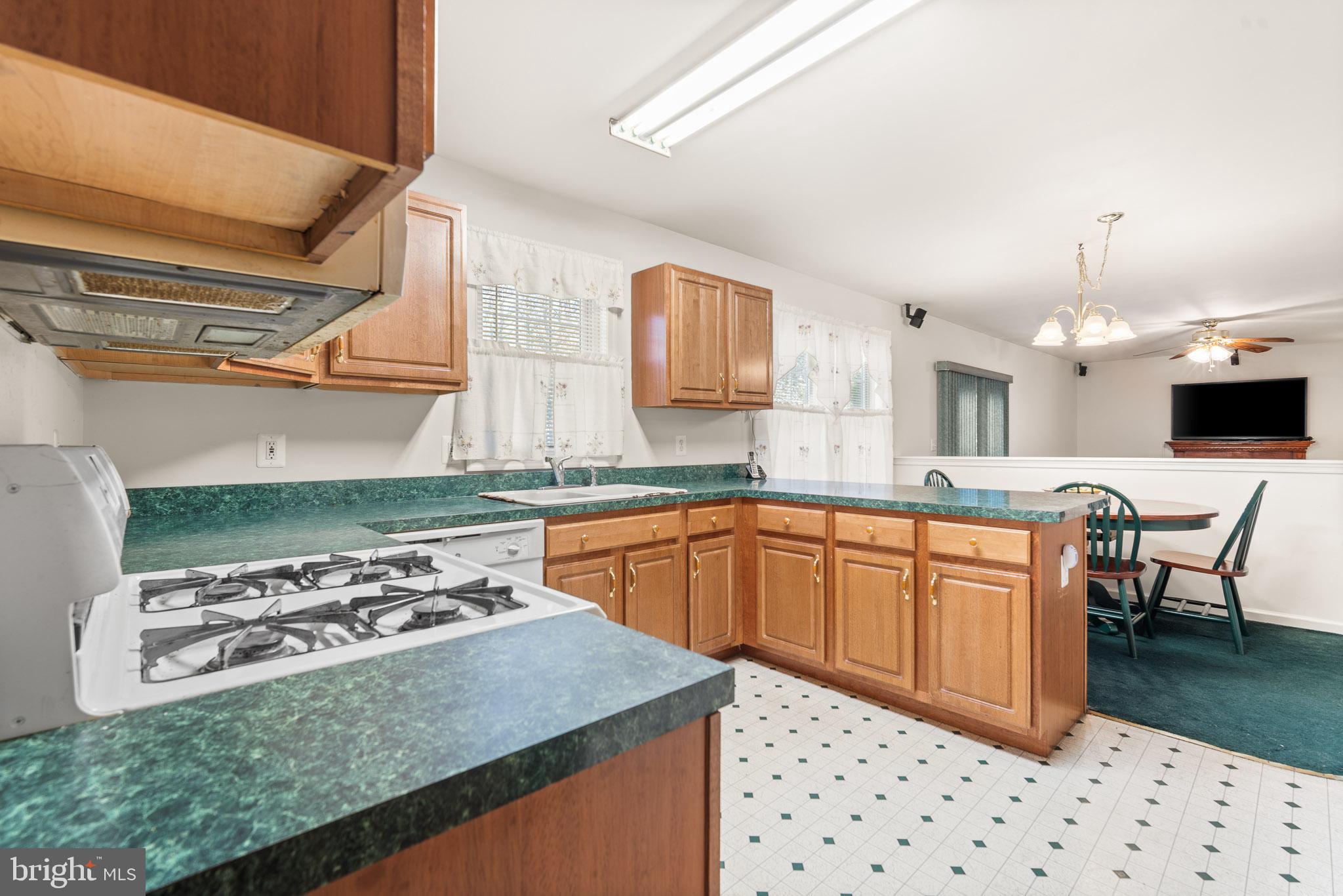 202 North New York Road Galloway Township, NJ 08205 - Photo 12 of 34 a kitchen with stainless steel appliances a stove a sink dishwasher and a refrigerator