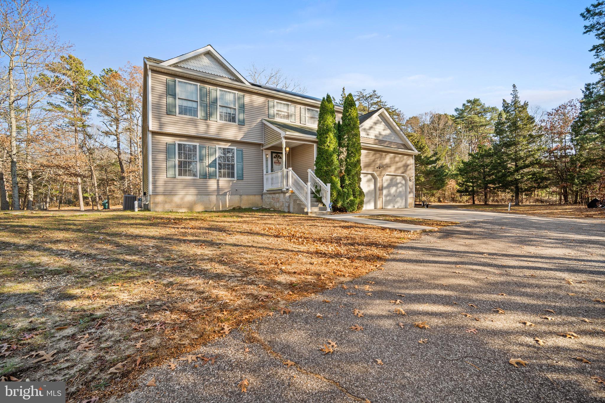202 North New York Road Galloway Township, NJ 08205 - Photo 2 of 34 a front view of a building with a garden