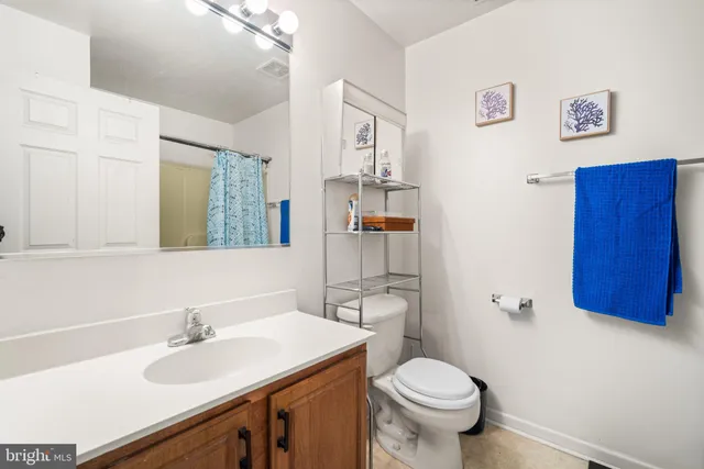 a bedroom with a bed and flat screen tv