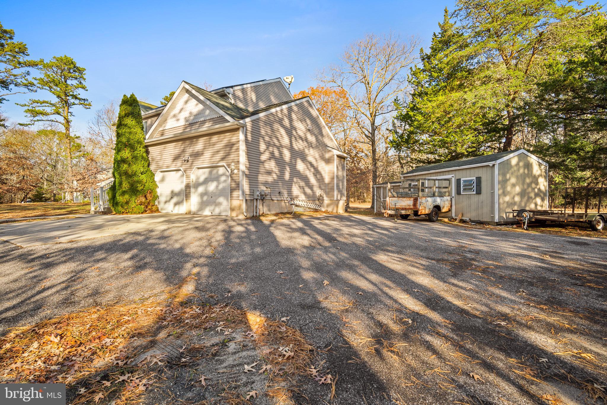 202 North New York Road Galloway Township, NJ 08205 - Photo 3 of 34 a view of a large white house with a snow on the road