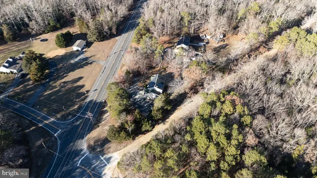 an aerial view of house with yard