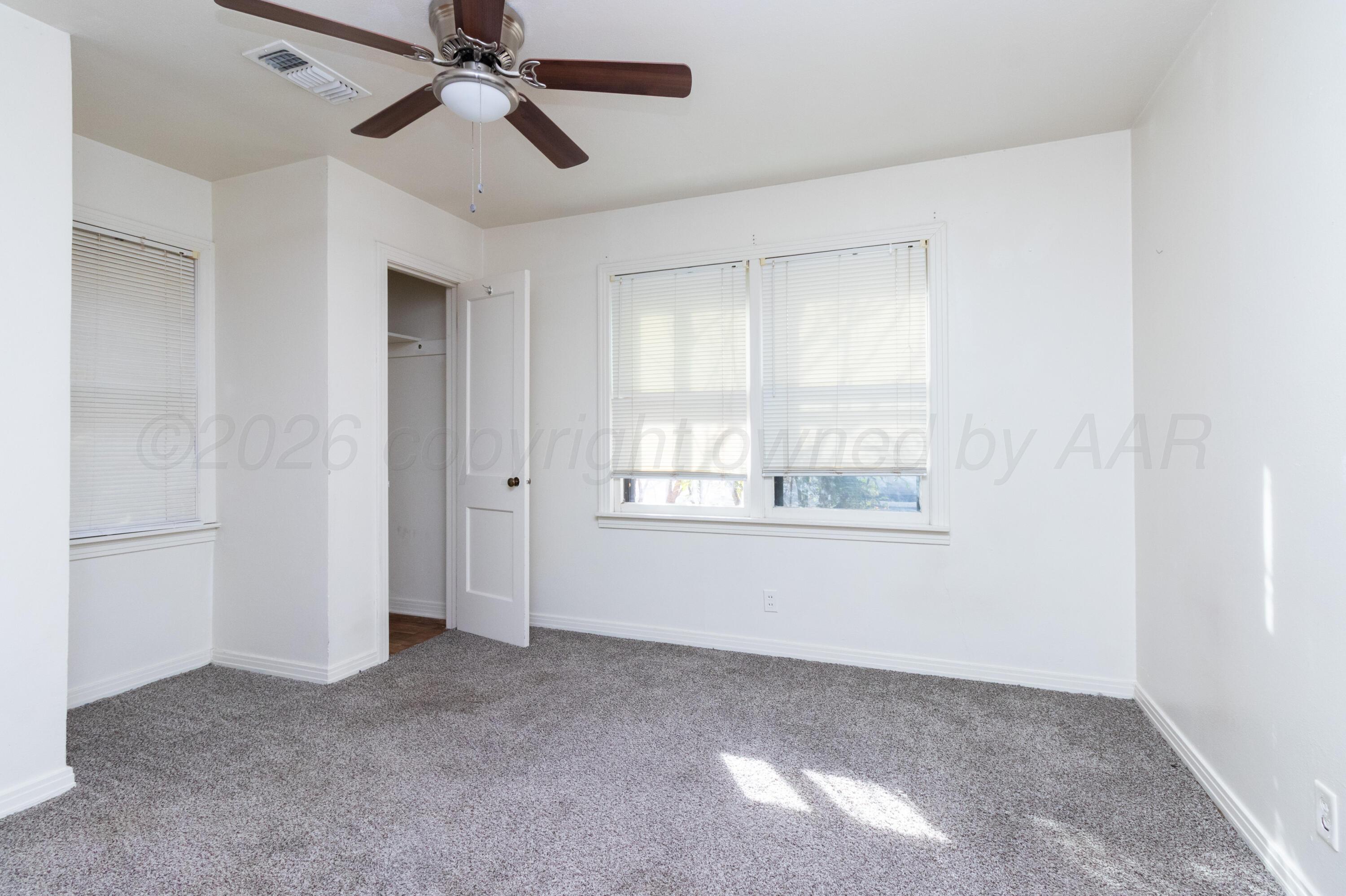4211 South Travis Street Amarillo, TX 79110 - Photo 12 of 21 a view of an empty room with a window