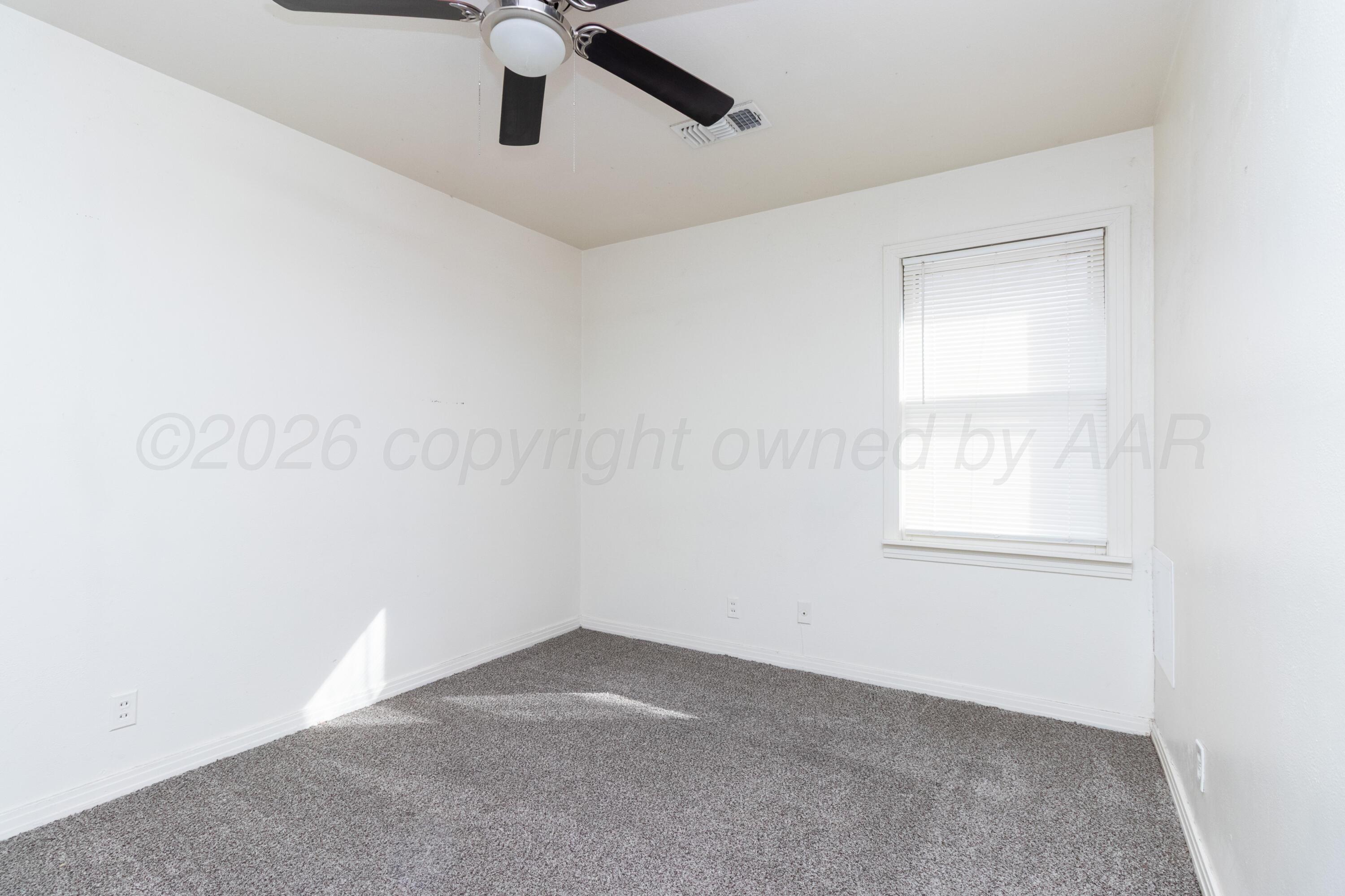 4211 South Travis Street Amarillo, TX 79110 - Photo 13 of 21 an empty room with windows