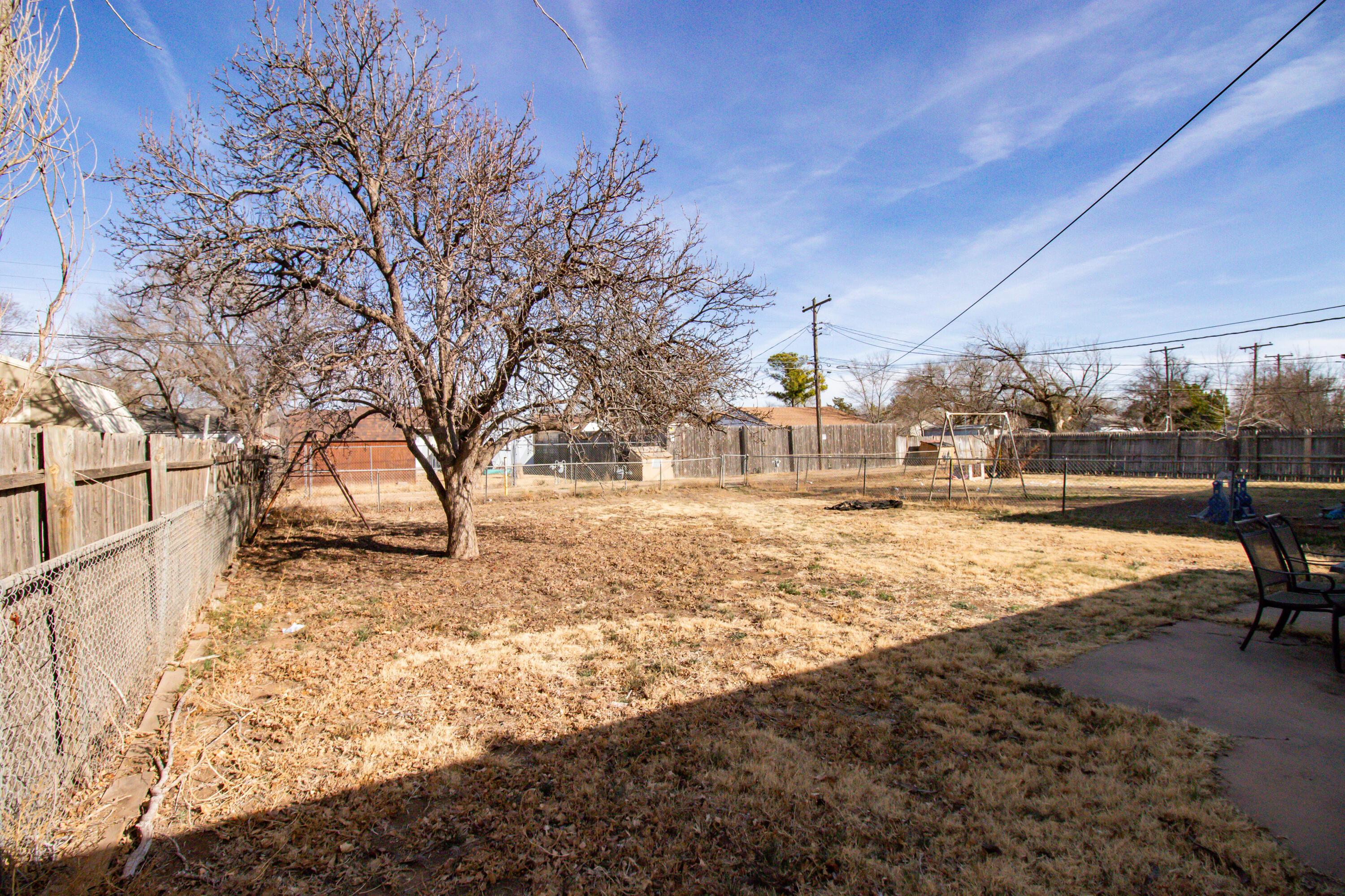 4211 South Travis Street Amarillo, TX 79110 - Photo 21 of 21 a view of yard covered with snow in front of house
