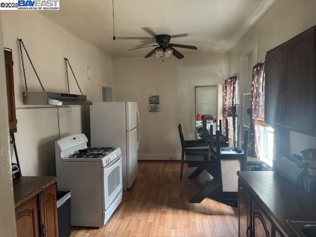 1009 Addison Street Berkeley, CA 94710 - Photo 13 of 34 a view of a workspace with furniture and wooden floor