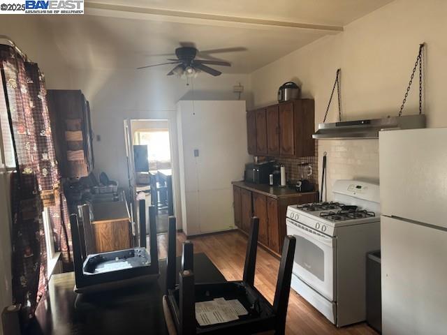 1009 Addison Street Berkeley, CA 94710 - Photo 14 of 34 a kitchen with stainless steel appliances granite countertop a refrigerator and a stove top oven