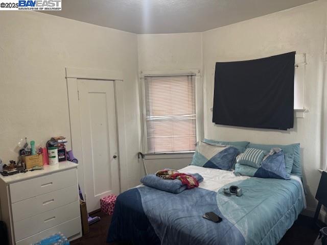 1009 Addison Street Berkeley, CA 94710 - Photo 20 of 34 a bedroom with a bed and flat screen tv