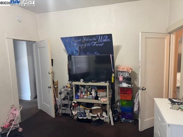 1009 Addison Street Berkeley, CA 94710 - Photo 21 of 34 a room with furniture and a flat screen tv