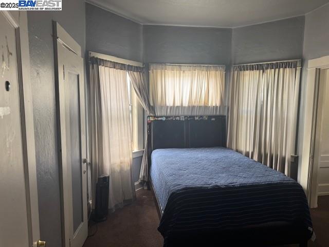 1009 Addison Street Berkeley, CA 94710 - Photo 22 of 34 a bedroom with a bed and a window