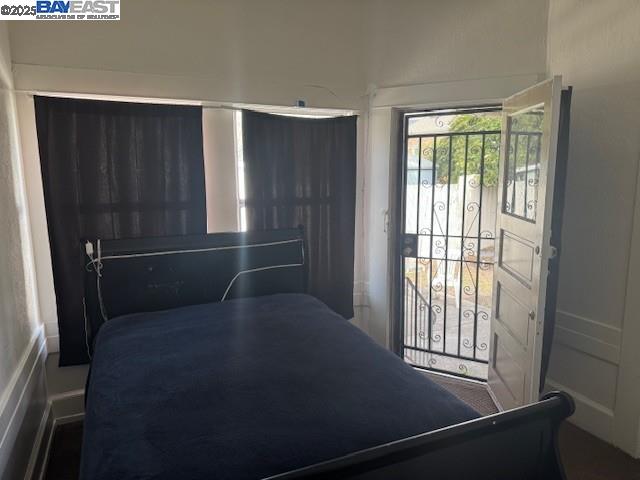 1009 Addison Street Berkeley, CA 94710 - Photo 25 of 34 a view of empty room with wooden floor and fan