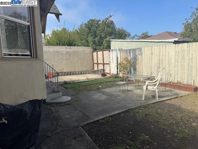 1009 Addison Street Berkeley, CA 94710 - Photo 31 of 34 a backyard of a house with table and chairs