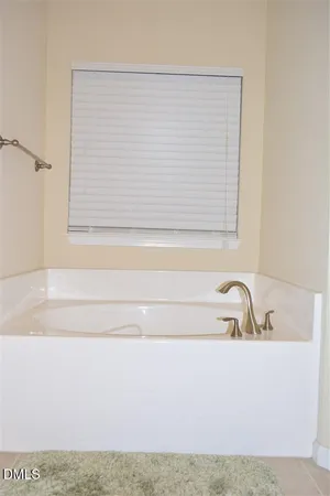 a bathroom with a sink vanity and mirror