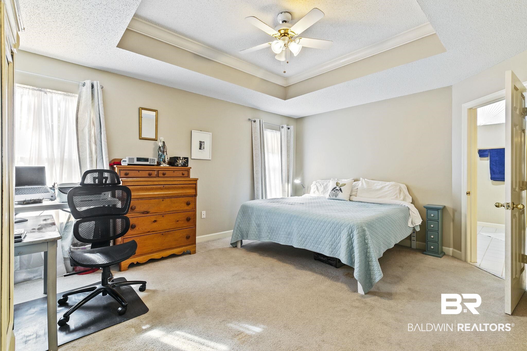 22 Pirates Lane Daphne, AL 36527 - Photo 23 of 36 Bedroom with light colored carpet, a raised ceiling, ceiling fan, and crown molding