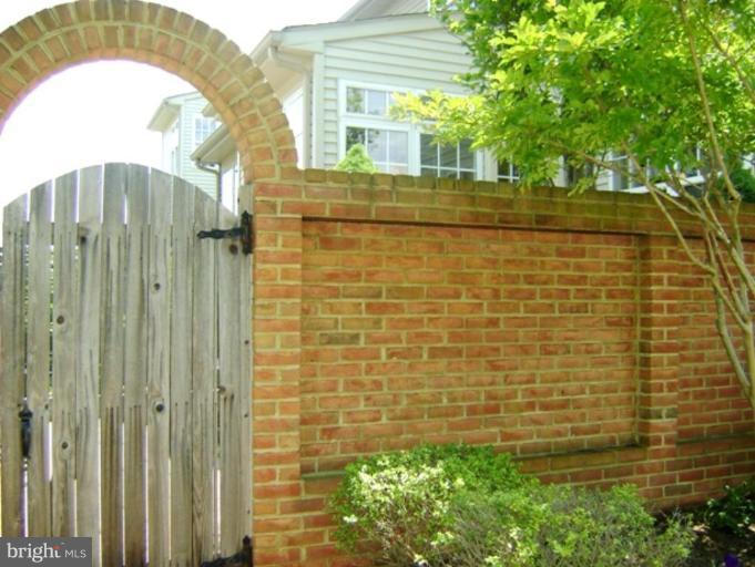 2638 Mill Race Road Frederick, MD 21701 - Photo 3 of 21 BrickWall/Fence leading to Backyard