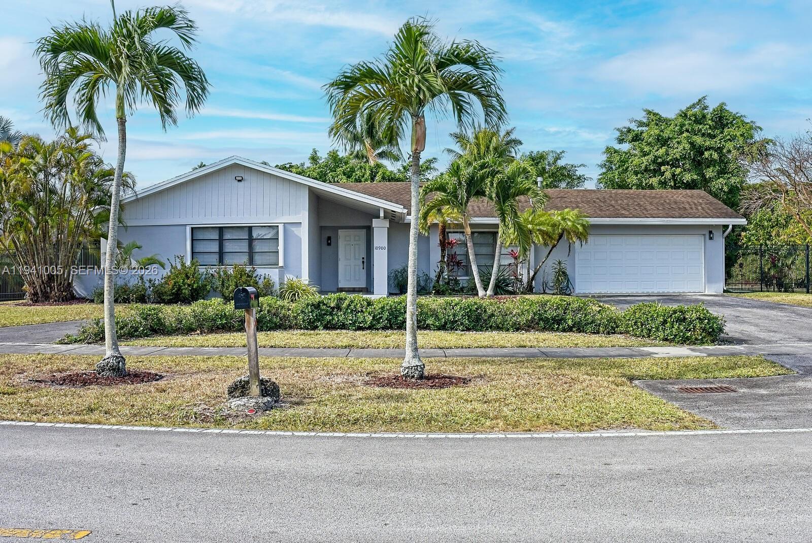 a house with palm tree in front of it