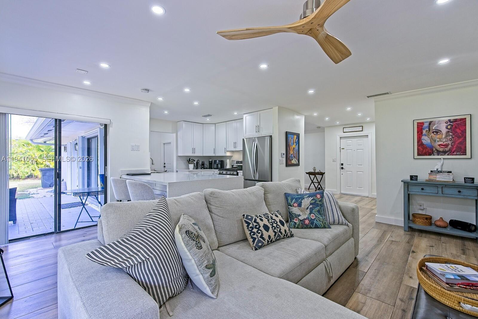 10900 Southwest 124th Road Miami, FL 33176 - Photo 11 of 22 a living room with furniture and a view of kitchen