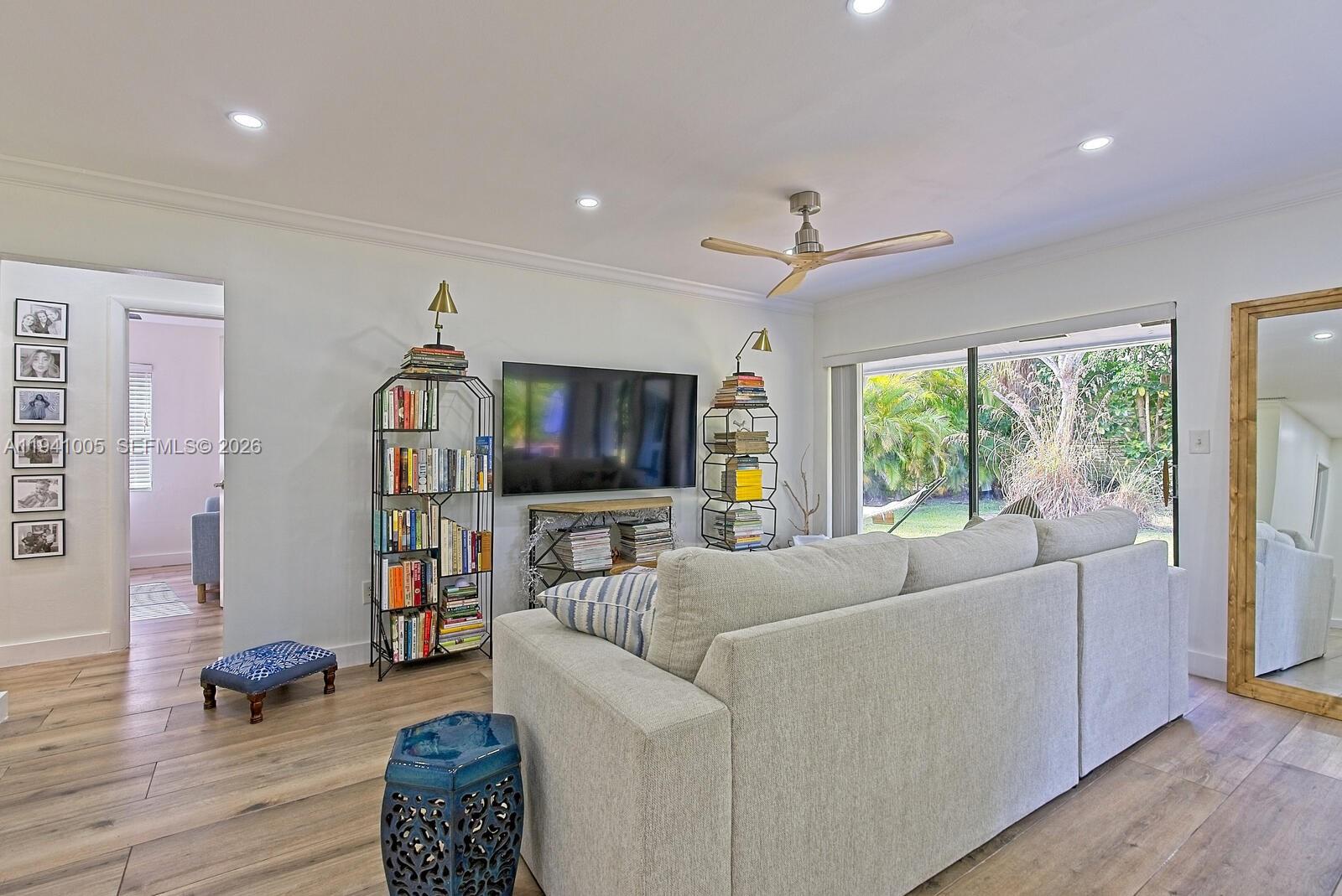 10900 Southwest 124th Road Miami, FL 33176 - Photo 13 of 22 a living room with furniture and a flat screen tv