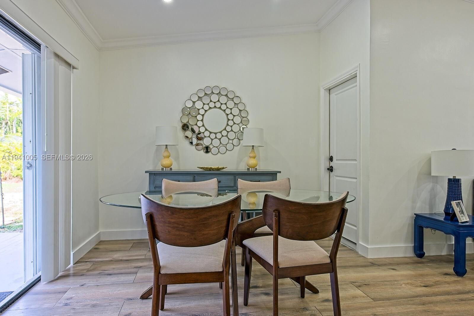 10900 Southwest 124th Road Miami, FL 33176 - Photo 6 of 22 a dining room with furniture and wooden floor