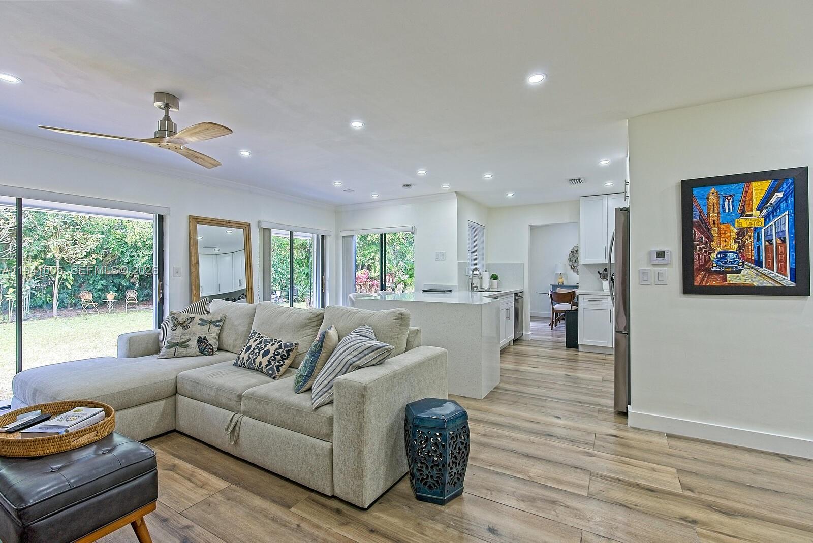10900 Southwest 124th Road Miami, FL 33176 - Photo 10 of 22 a living room with furniture and a large window