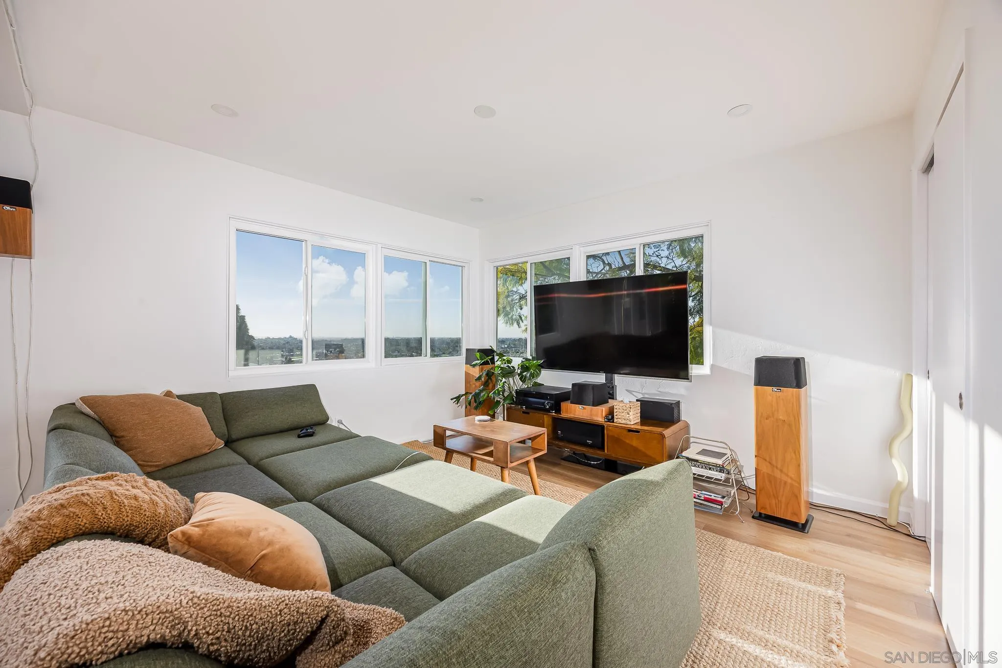 4344 Avon Drive La Mesa, CA 91941 - Photo 14 of 50 a living room with furniture and a flat screen tv