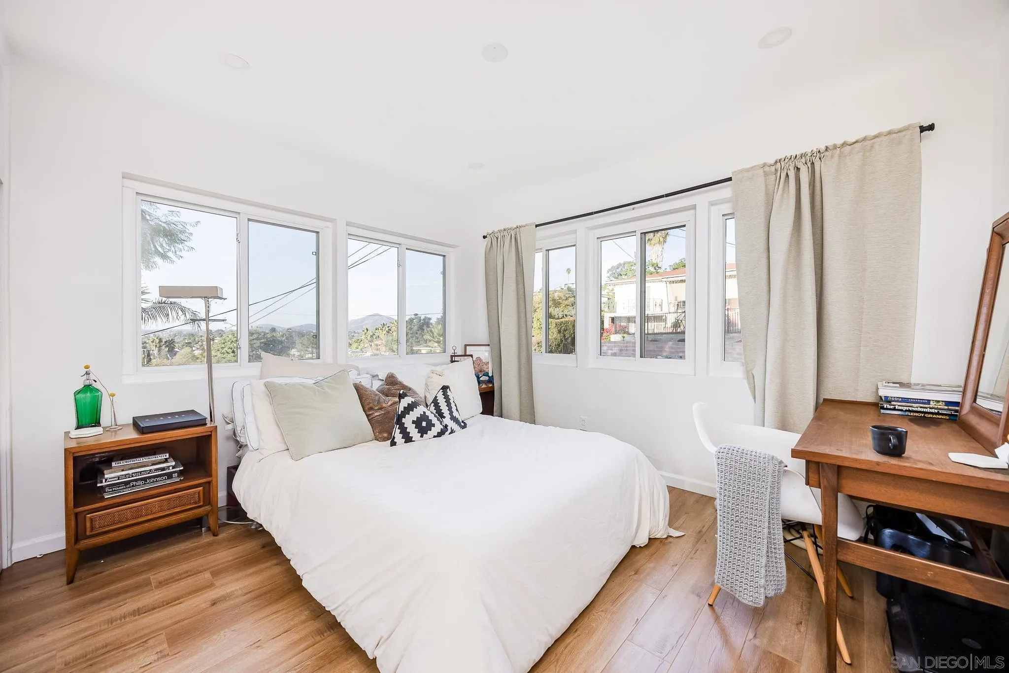 4344 Avon Drive La Mesa, CA 91941 - Photo 17 of 50 a bedroom with a bed and large windows