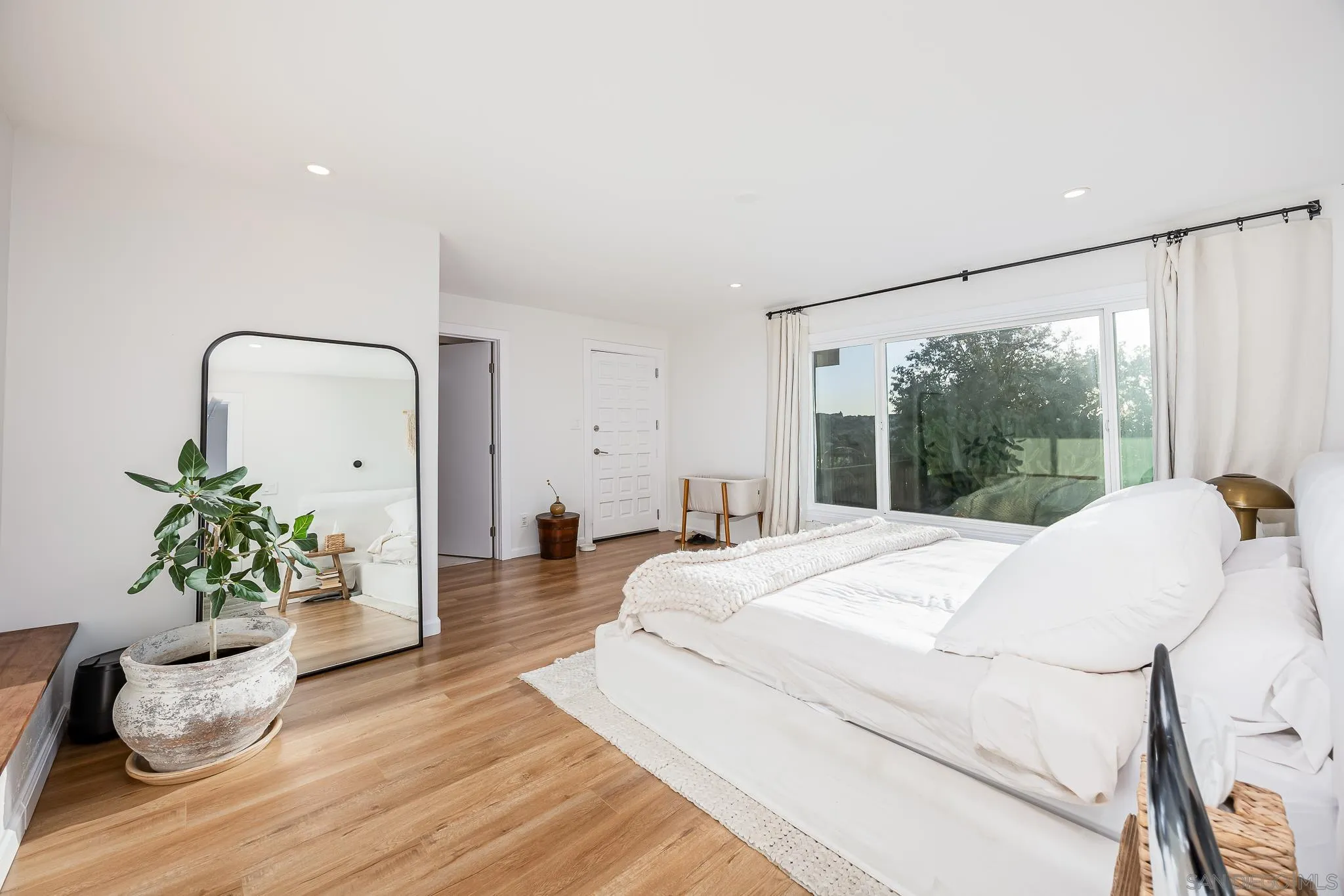 4344 Avon Drive La Mesa, CA 91941 - Photo 24 of 50 a bedroom with a bed and a large window