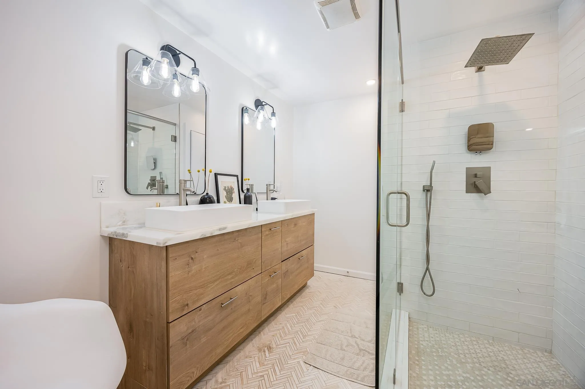 4344 Avon Drive La Mesa, CA 91941 - Photo 25 of 50 a bathroom with a double vanity sink mirror and shower