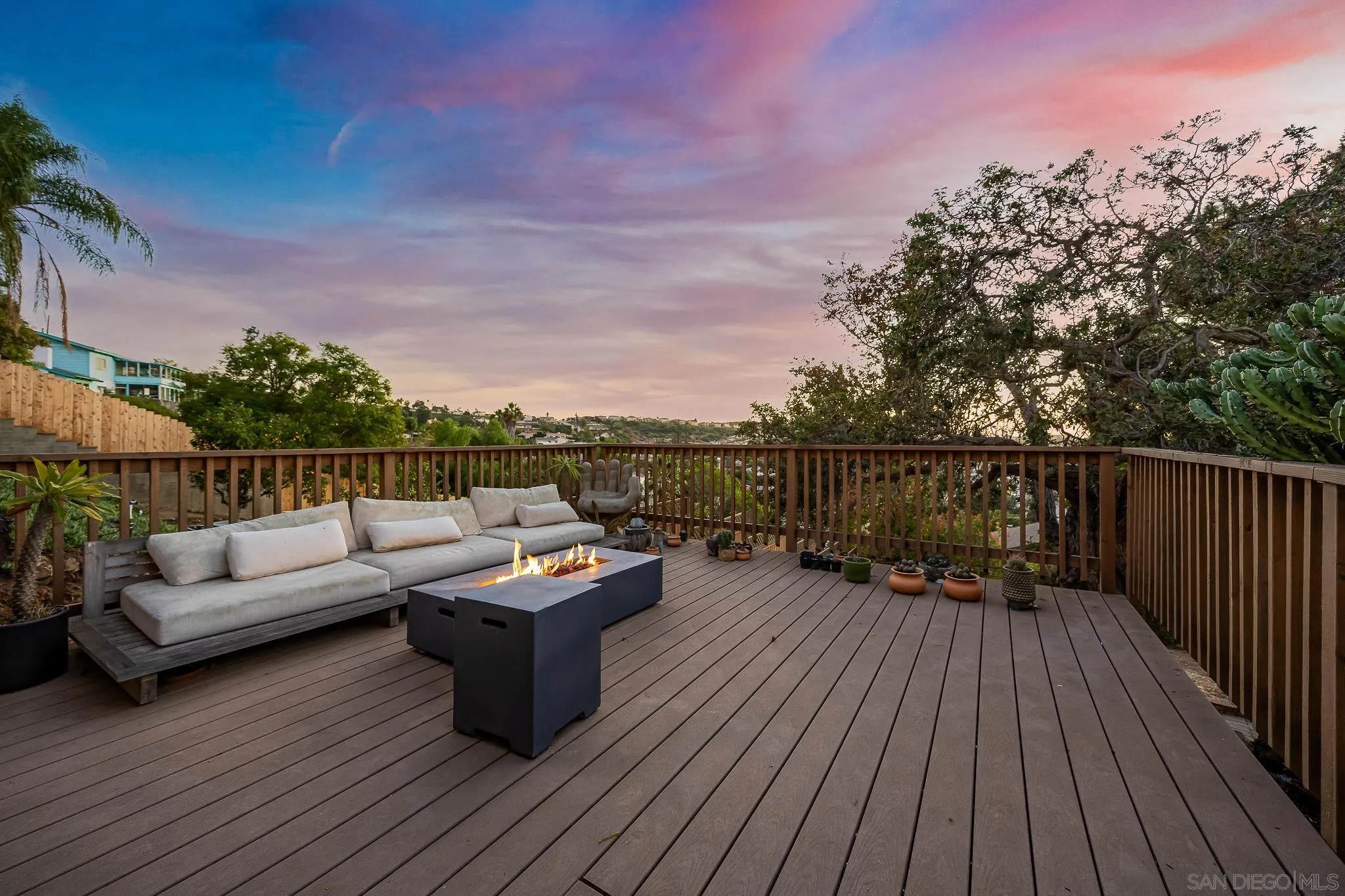 4344 Avon Drive La Mesa, CA 91941 - Photo 28 of 50 a balcony with wooden floor and outdoor seating