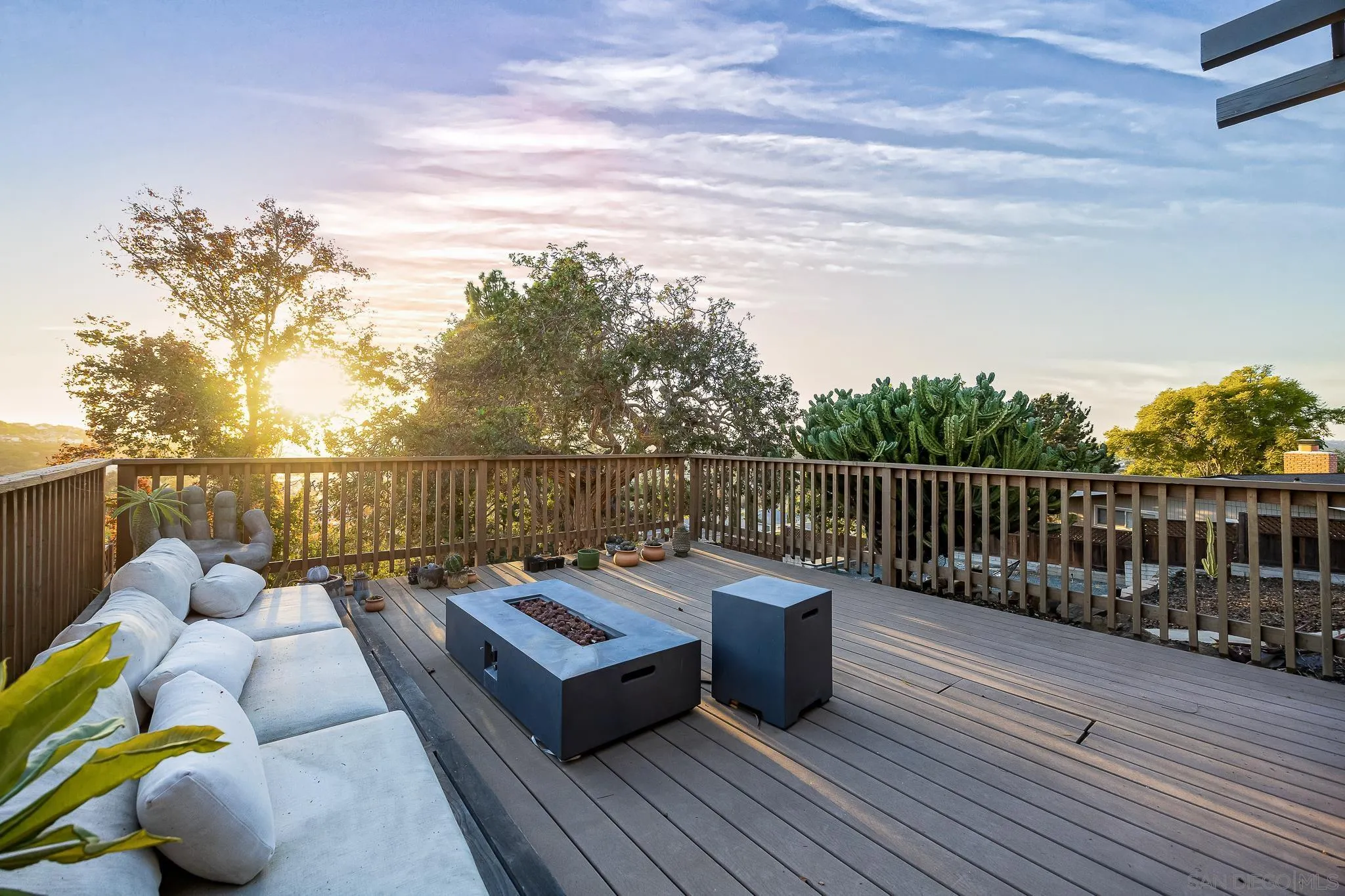 4344 Avon Drive La Mesa, CA 91941 - Photo 29 of 50 a balcony with wooden floor table and chairs