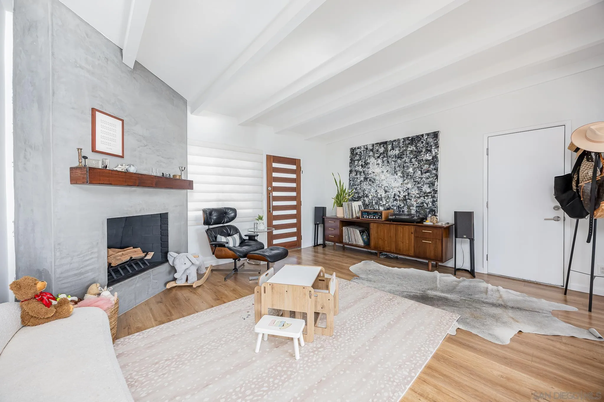 4344 Avon Drive La Mesa, CA 91941 - Photo 6 of 50 a living room with furniture a fireplace and a flat screen tv