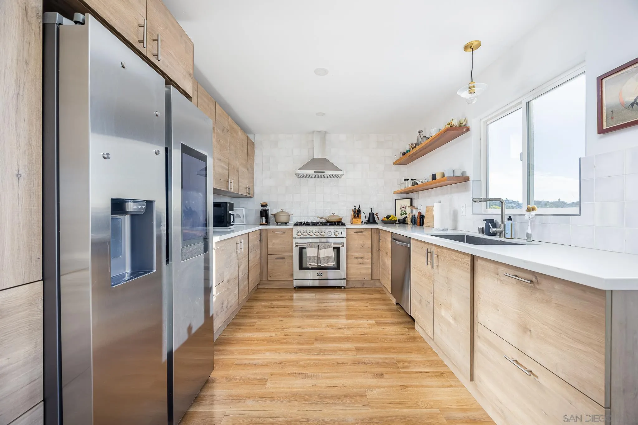 4344 Avon Drive La Mesa, CA 91941 - Photo 7 of 50 a kitchen with stainless steel appliances a refrigerator and a sink