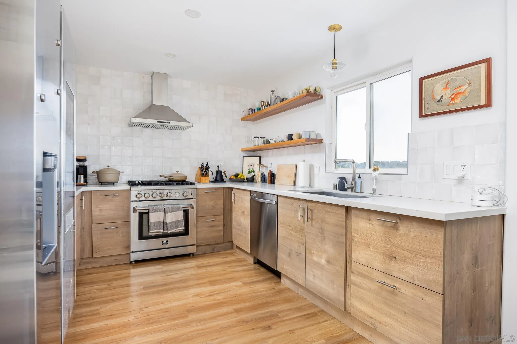 4344 Avon Drive La Mesa, CA 91941 - Photo 9 of 50 a kitchen with stainless steel appliances a sink stove and cabinets