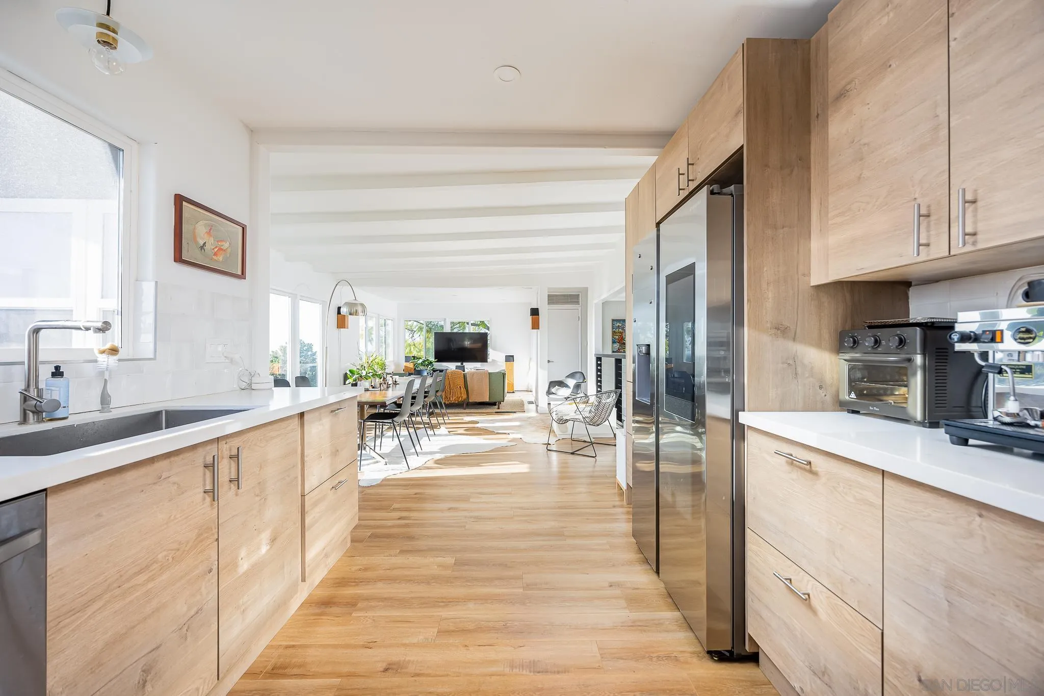 4344 Avon Drive La Mesa, CA 91941 - Photo 10 of 50 a large white kitchen with cabinets