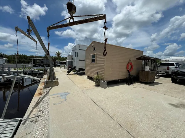 a view of a roof deck with couches and sky view