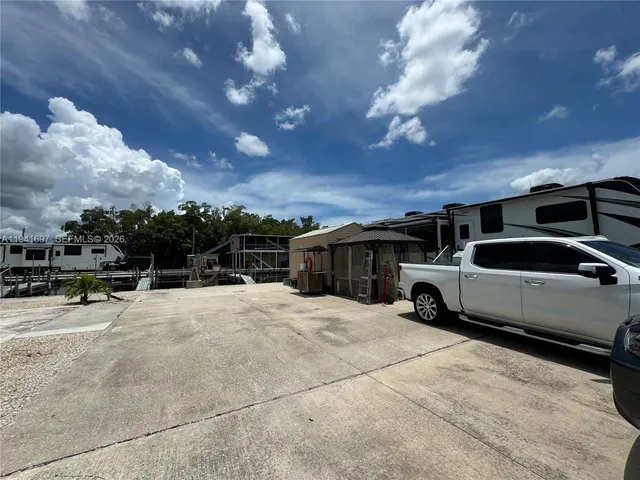 a view of living room kitchen and a sink