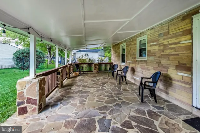 a view of a porch with furniture