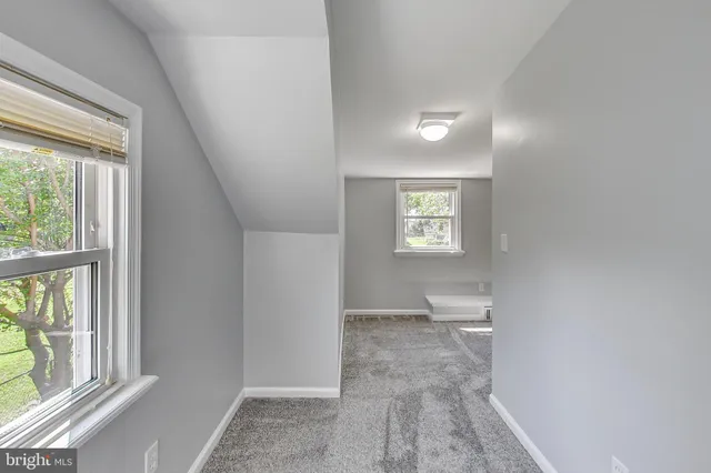 a view of a hallway with windows