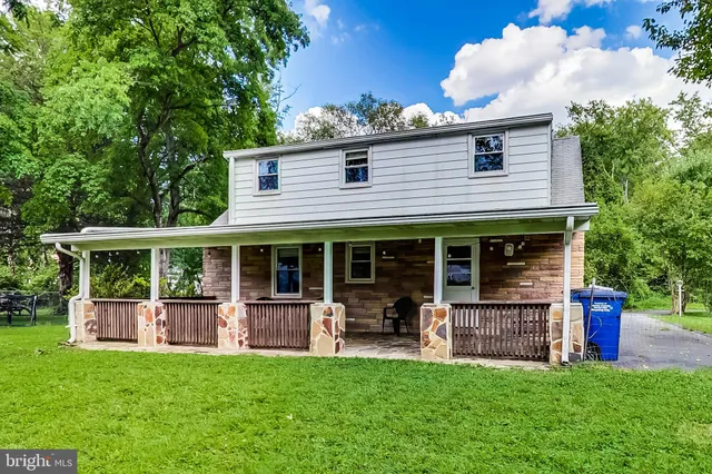 a view of a house with a deck and a garden