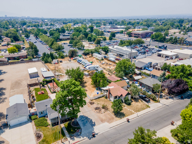 72 Cox Lane Midvale, UT 84047 - Photo 12 of 16 Aerial perspective showcasing residential properties and commercial establishments under a clear sky