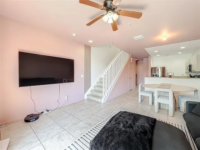 a view of a livingroom with furniture and a flat screen tv