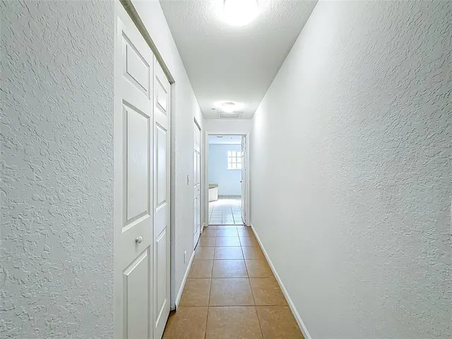 a view of walk in closet with clothes
