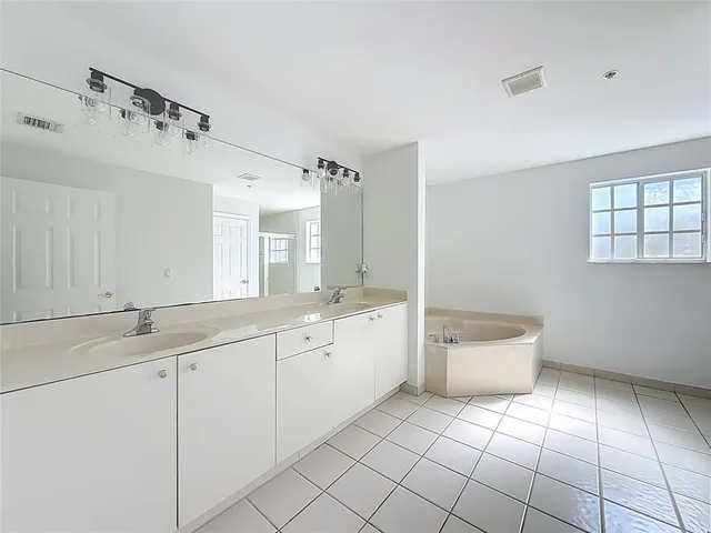 a bathroom with a shower and a sink