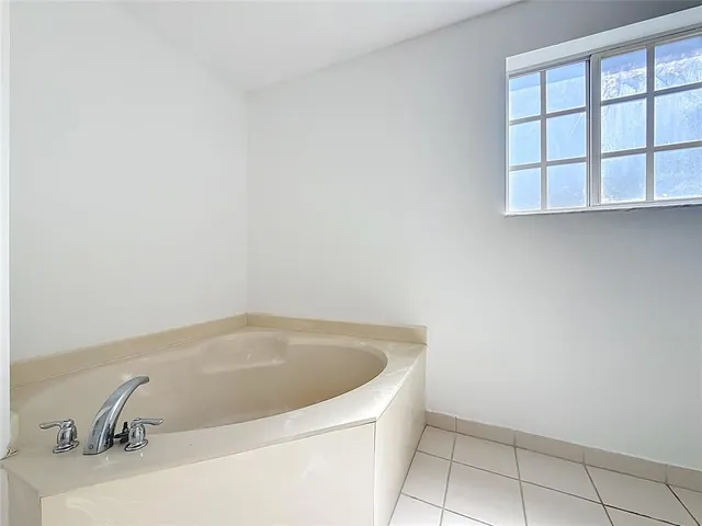 a white toilet sitting in a bathroom