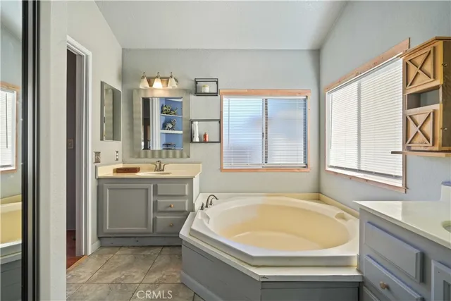 a bathroom with a bathtub and a sink