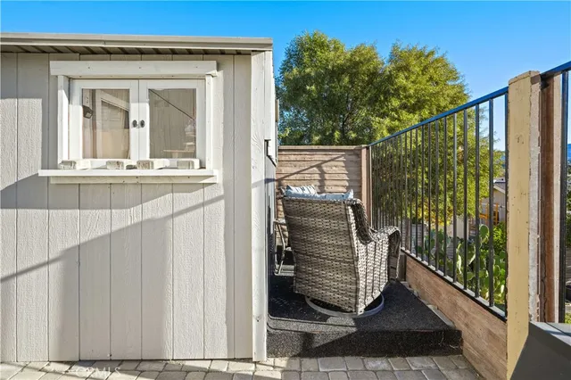 a view of balcony with furniture